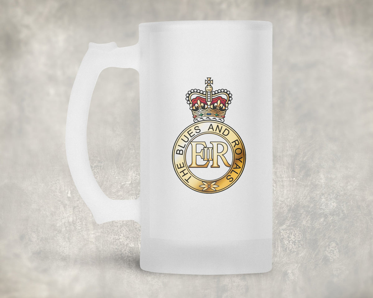 A frosted glass beer mug with a printed crest featuring a crown and the text 'BLUES AND ROYALS' with 'ER' in the center, set against a textured gray background.