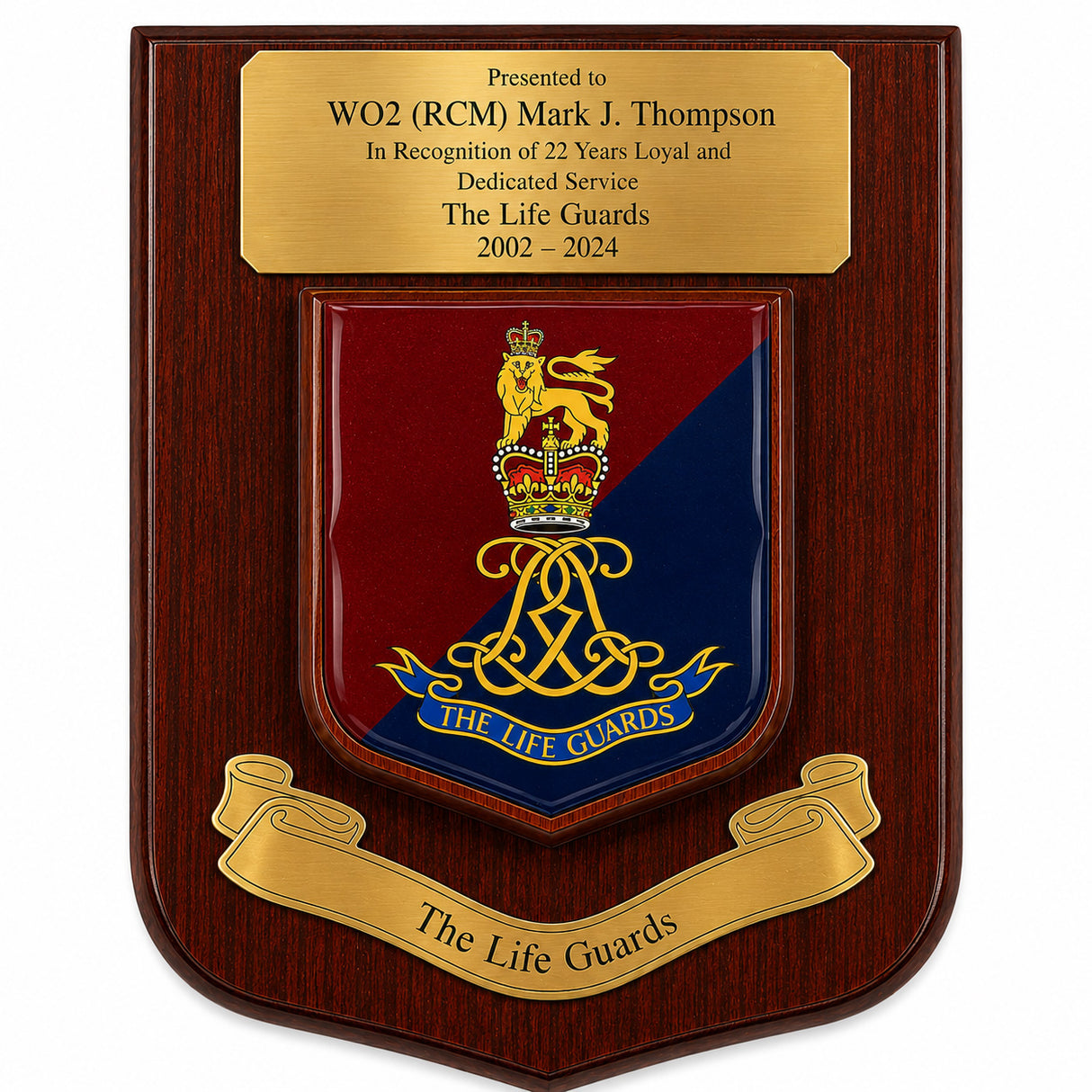 A wooden commemorative plaque with a polished gold-tone top inscription plate and a central shield featuring the Life Guards crest in red and blue with gold detailing, plus a gold scroll reading 'The Life Guards' at the bottom.