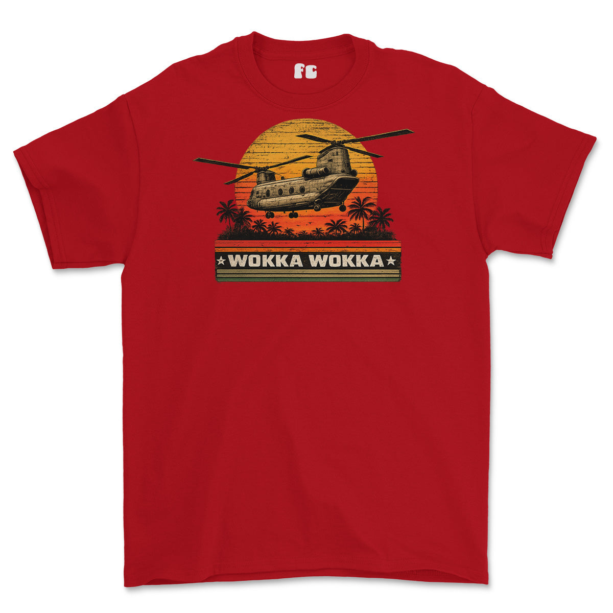 A red short-sleeve crewneck t-shirt featuring a retro graphic of a military helicopter flying over a sunset with palm trees and the text 'WOKKA WOKKA' on a black banner.