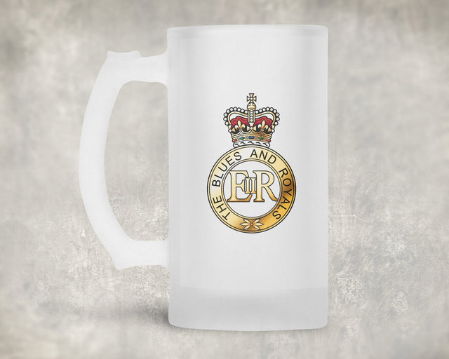 A frosted glass beer mug with a printed crest featuring a crown and the text 'BLUES AND ROYALS' with 'ER' in the center, set against a textured gray background.