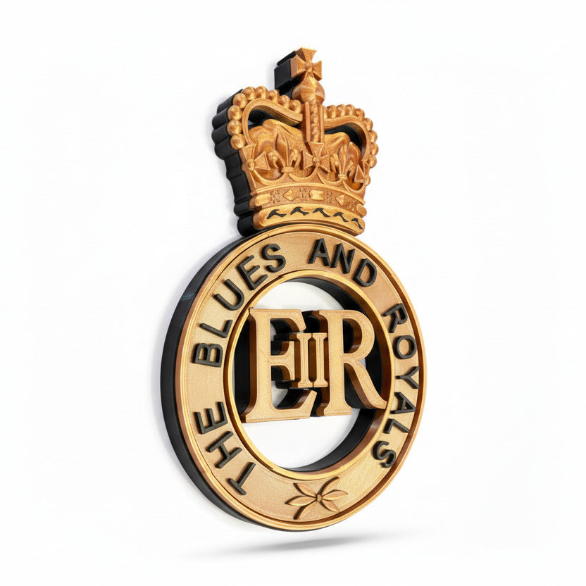 Decorative emblem with a crown and 'The Blues and Royals' text on a white background