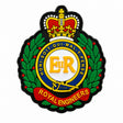 A Royal Engineers crest patch or emblem with a crown, green laurel wreath, yellow EII R letters, blue ring, red scroll reading ROYAL ENGINEERS, and black outline on a white background.