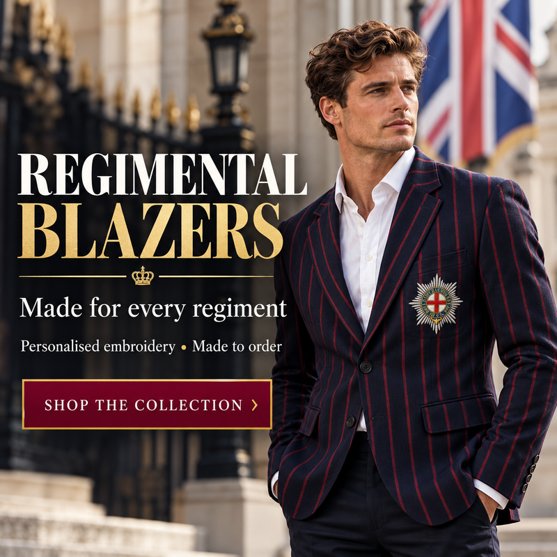 A man wearing a navy blue pinstripe blazer with red stripes over a white dress shirt, standing outdoors in front of a building with flags. Large text on the left reads 'REGIMENTAL BLAZERS' with additional promotional copy and a 'SHOP THE COLLECTION' button.