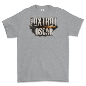 A heather gray short-sleeve crewneck t-shirt featuring a distressed graphic print on the chest that reads 'FOXTROT OSCAR' with a bullet graphic behind it.