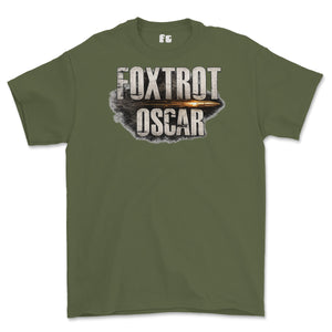 An olive green short-sleeve t-shirt with a graphic on the chest reading 'FOXTROT OSCAR' in distressed white letters over a bullet-hole style design with a gold-orange highlight.