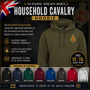 An olive green pullover hoodie with Household Cavalry regimental embroidery, displayed on a dark promotional background with text, size info, and a row of other available colors at the bottom.