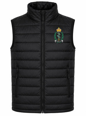 A black quilted zip-up puffer vest with a stand-up collar, featuring a green and gold Royal Army Medical Service crest embroidered on the left chest, displayed on a solid white background.
