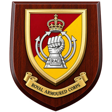 A shield-shaped wooden plaque featuring the Royal Armoured Corps (RAC) crest. The crest has a red and yellow diagonal background with a raised silver fist under a gold crown, mounted on a dark reddish-brown wood-grain plaque with a gold ribbon banner reading 'ROYAL ARMOURED CORPS'.