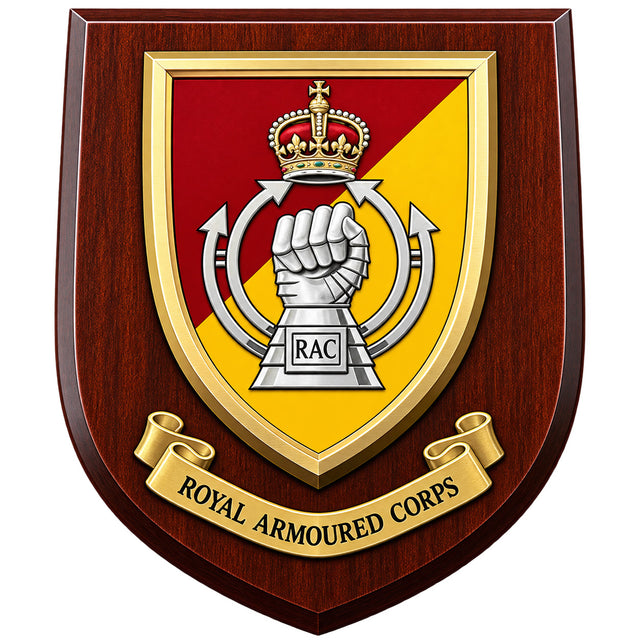 A shield-shaped wooden plaque featuring the Royal Armoured Corps (RAC) crest. The crest has a red and yellow diagonal background with a raised silver fist under a gold crown, mounted on a dark reddish-brown wood-grain plaque with a gold ribbon banner reading 'ROYAL ARMOURED CORPS'.