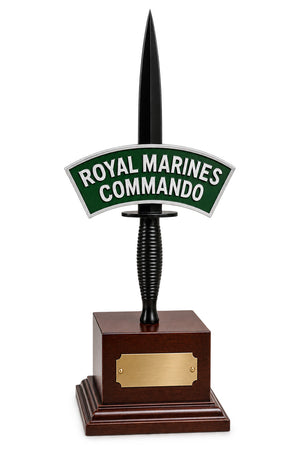 Royal Marines Commando dagger trophy mounted on a polished dark wood base with a gold-toned plaque, shown on a white background.