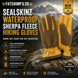 A pair of Fatchimp & Co Sealskinz Waterproof Sherpa Fleece Hiking Gloves displayed on a rock against a mountain backdrop. The gloves feature brown sherpa fleece lining and tan synthetic palms, with adjustable cuffs and a small red Fatchimp & Co logo on the wrist.