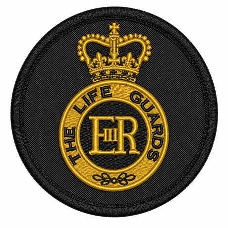 A circular embroidered patch featuring a black background with a gold crown and the text 'THE LIFE GUARDS' around a central 'ER' monogram.