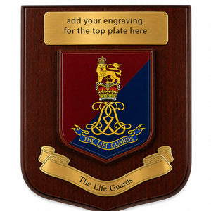 A custom wooden plaque featuring a Royal Life Guards crest with gold, red, and blue colors, a gold top plate with engraving text, and a gold scroll at the bottom reading 'The Life Guards'.
